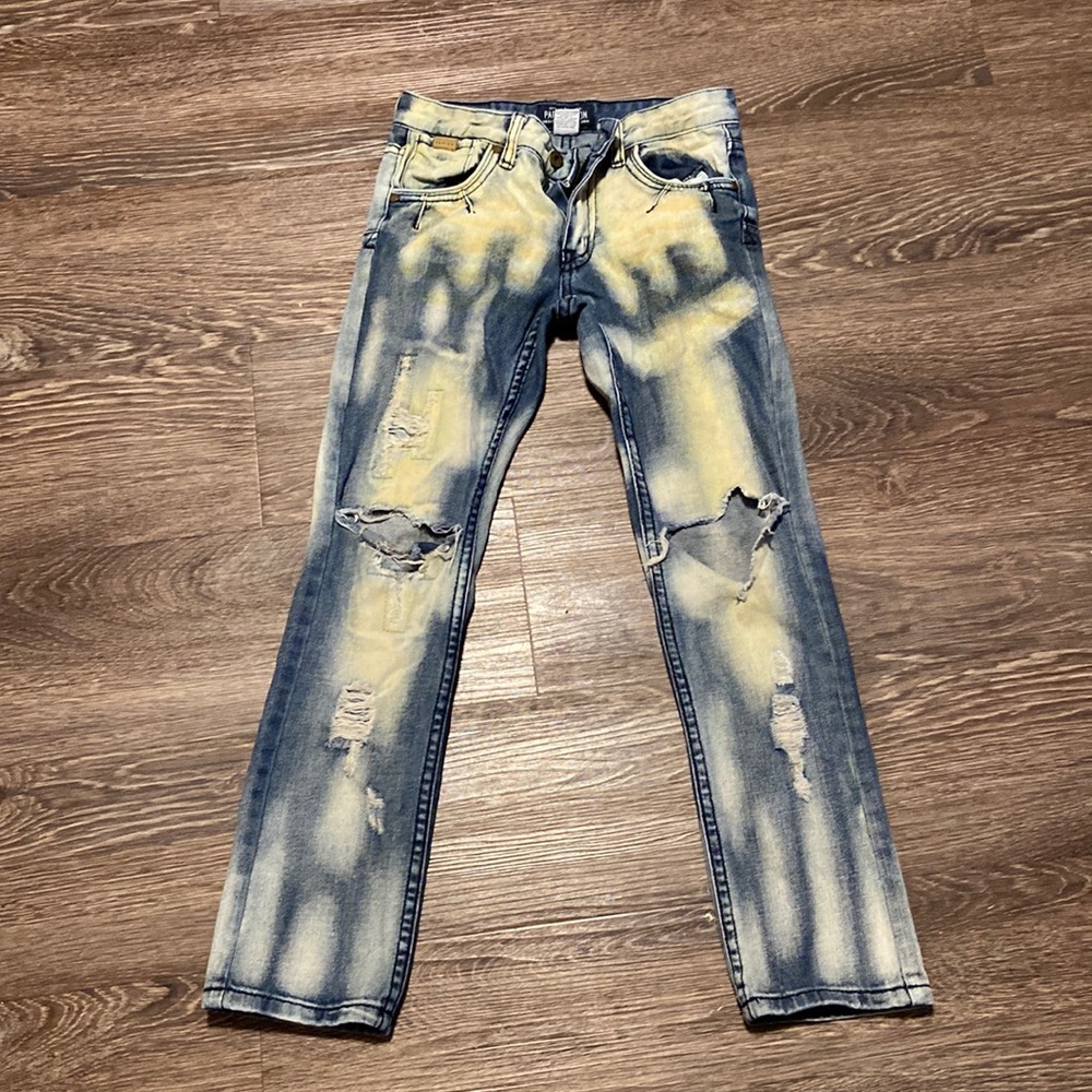 I’m selling some blue jeans with bleach spots